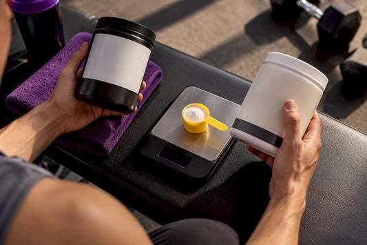 Hands checking supplement ratio beside measured powder